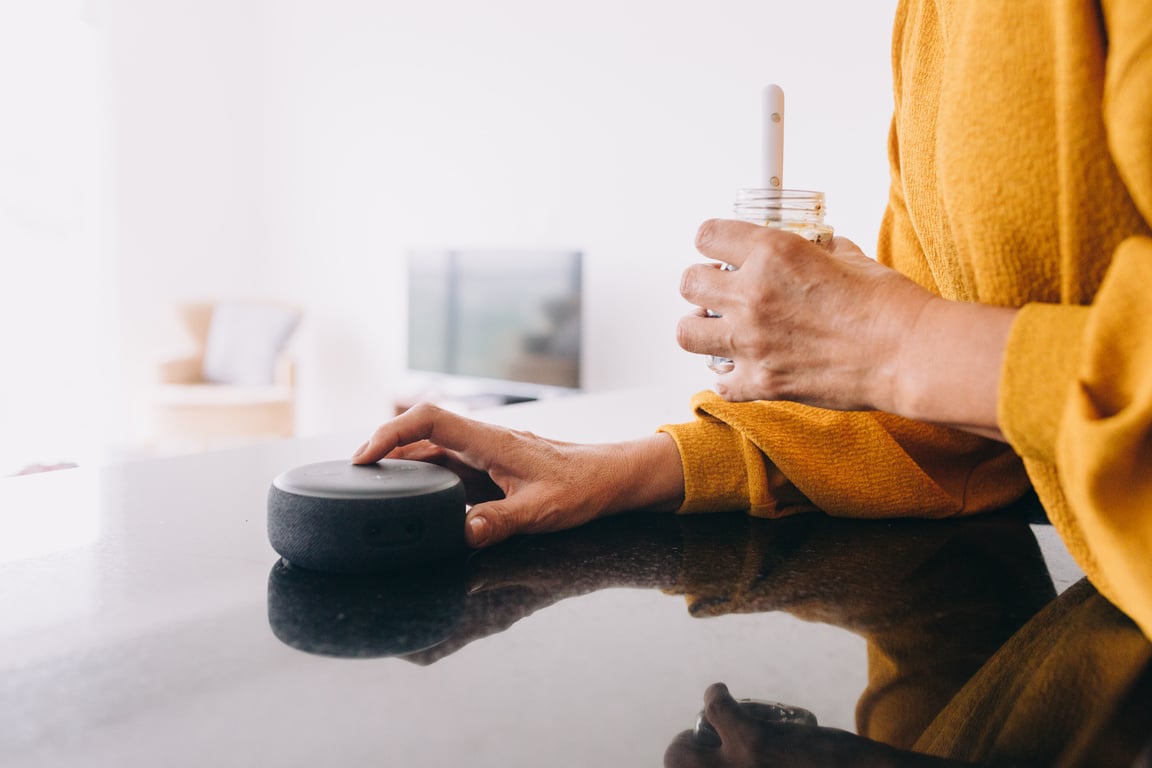 Woman with Smart Speaker at Home