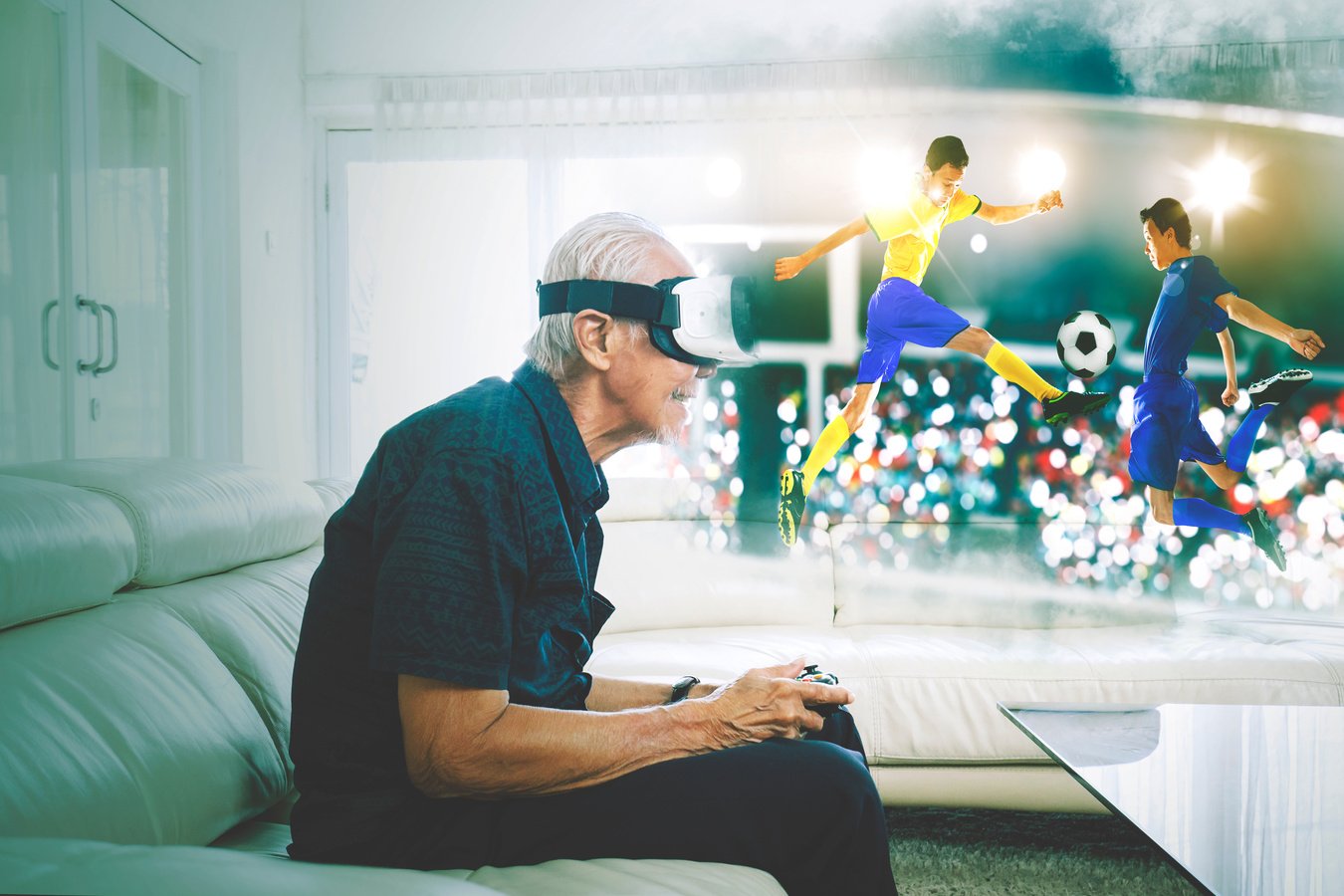 Old Man Playing a Football Match on the VR Glasses