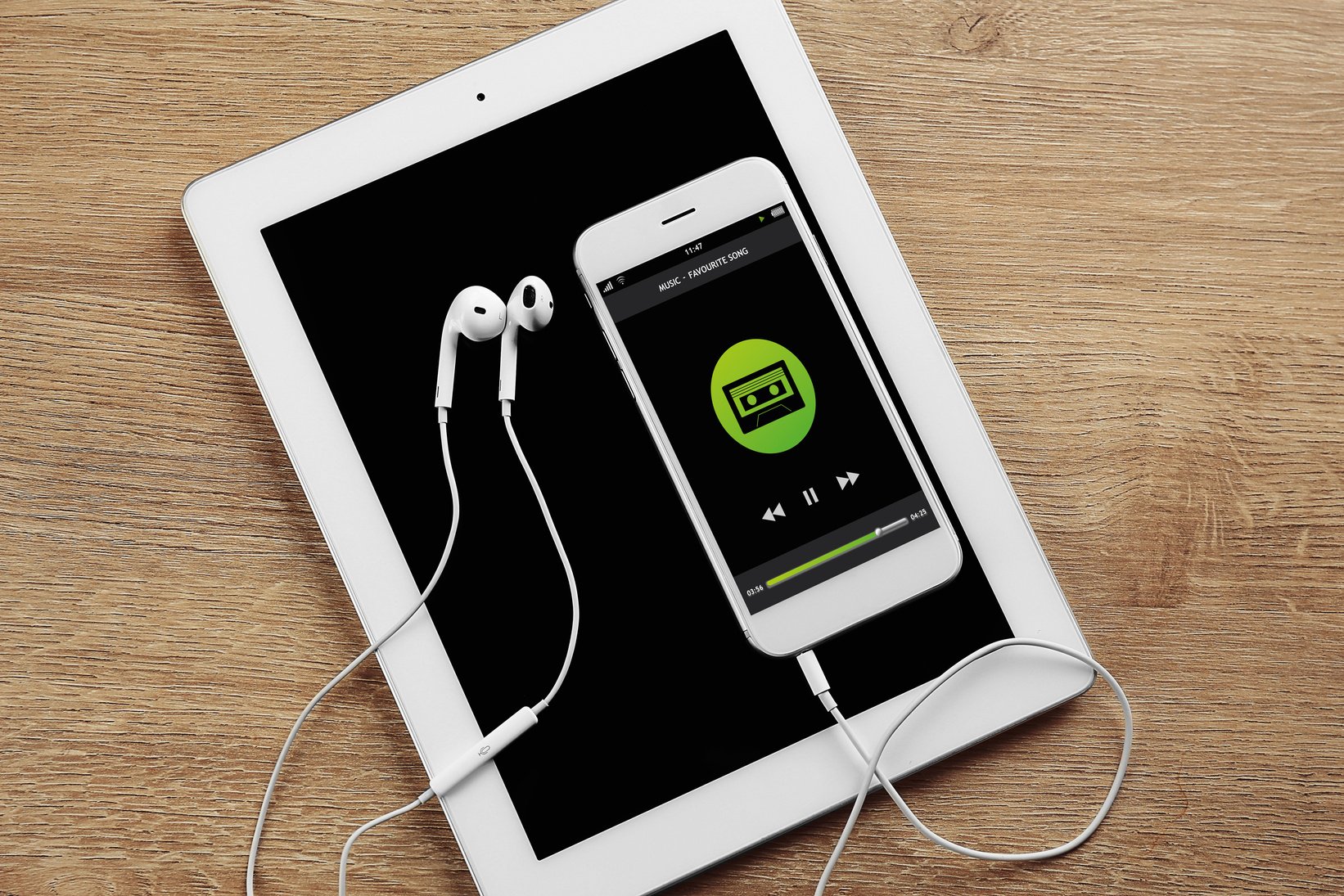 Tablet, Smartphone, and Headphones on Wooden Table